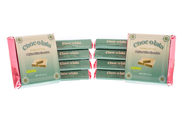 Multiple mini chocolate bars of Chocolata Dubai Style Belgian White Chocolate on a white background