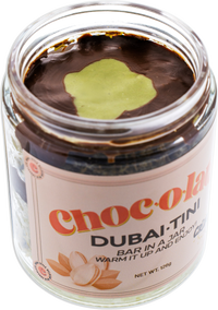 Open Jar of Choc-o-lata Dubai-Tini side view with a visible label on a white background