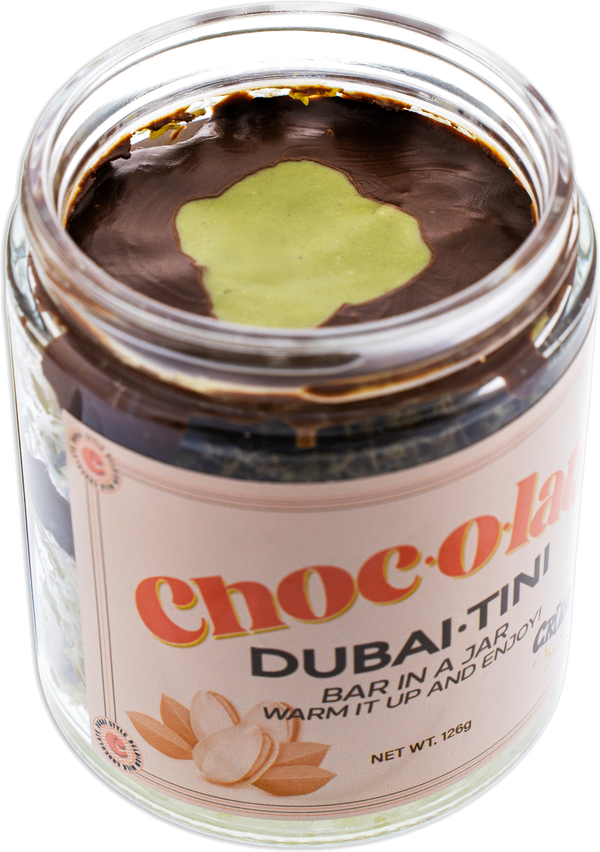Open Jar of Choc-o-lata Dubai-Tini side view with a visible label on a white background