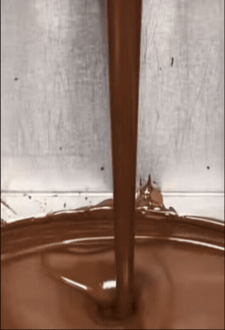 Chocolate pouring into molds for Dubai style chocolate bars pistachio swirl design on chocolate bars video