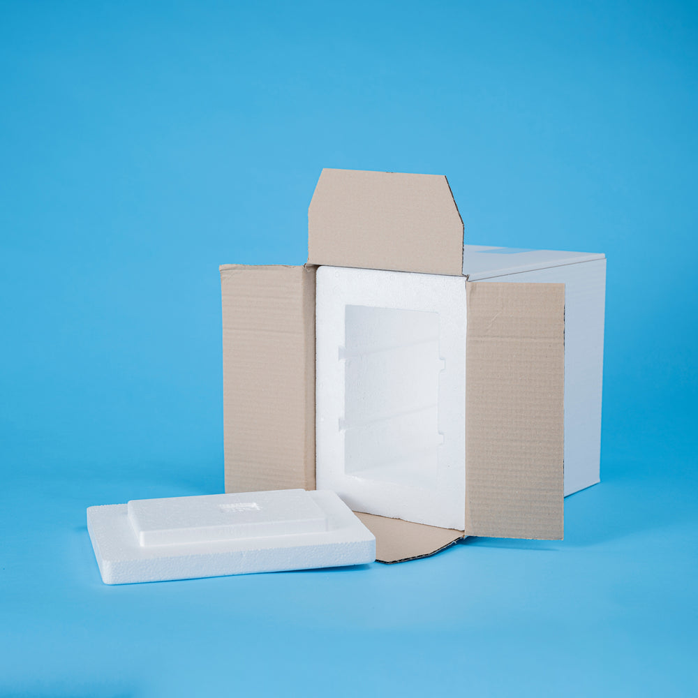 Cardboard box with foam inserts for cold packaging shipping on a blue background