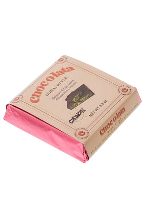 Chocolate bar with pink wrapper and visible brand name on a white background